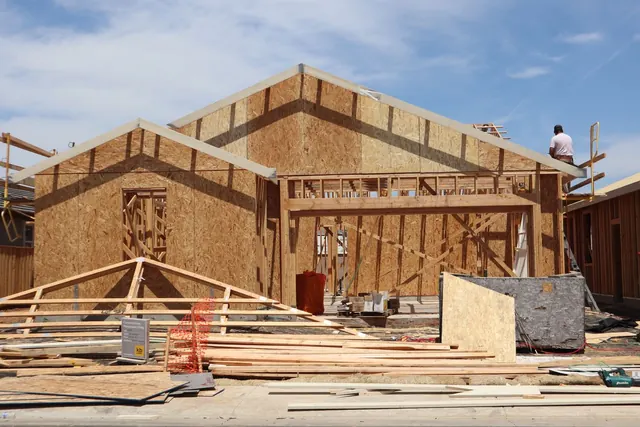 Roof framing going up on a single-storey addition